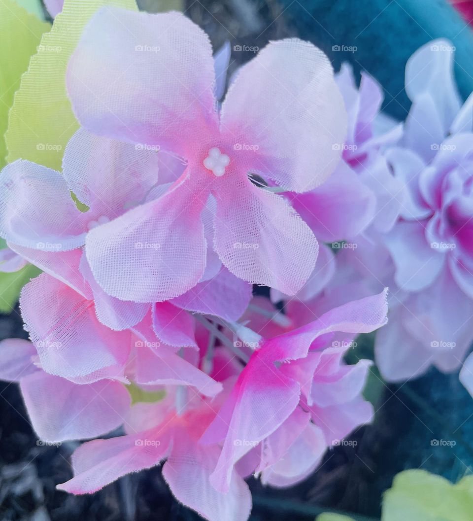 A photo of bright pink fake flowers. 