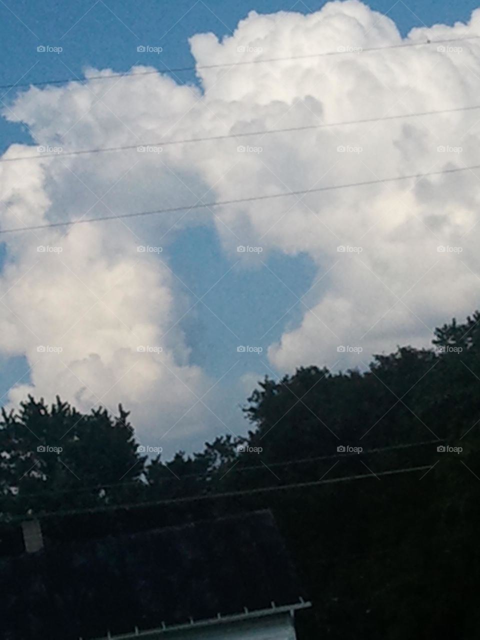 Heart in the clouds in the sky