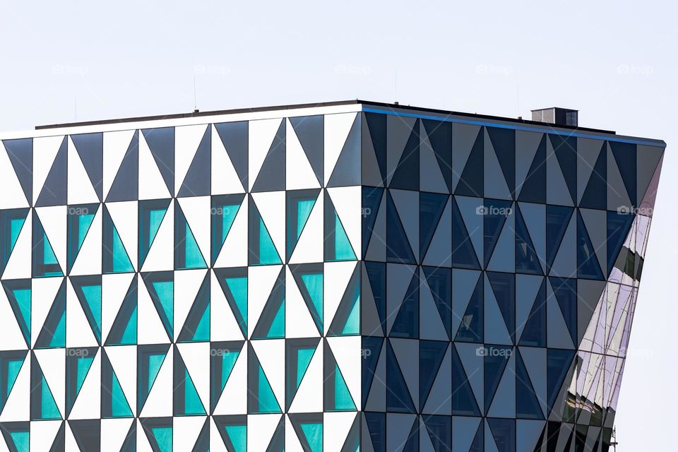 Triangle, glass building with windows shaped like triangles 