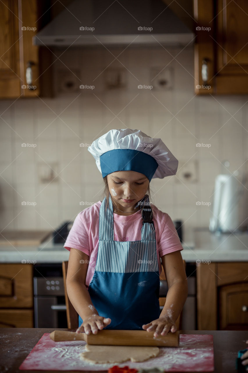 Little sisters cooking the biscuits 