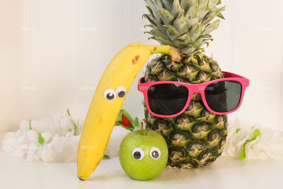 Fruit with funny eyes and glasses 