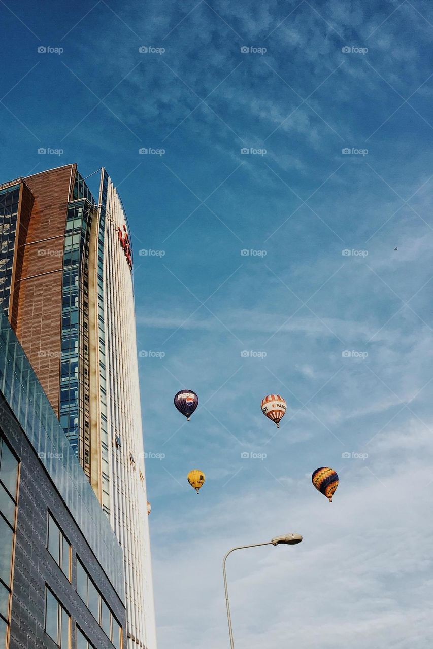 Colourful balloons above the city