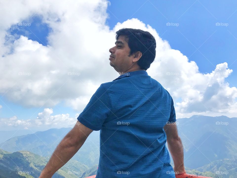 Man smiling and looking sideways