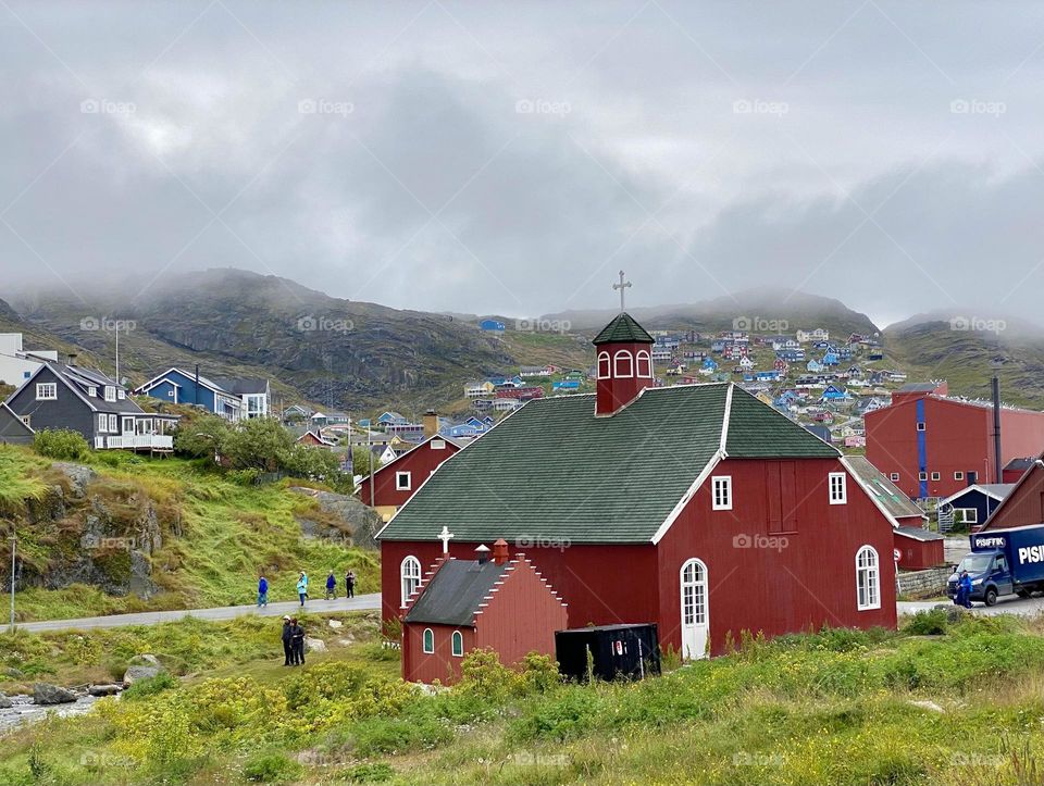 A red painted church in a small town in Greenland 