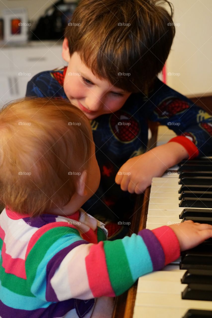 Young Children Playing Piano