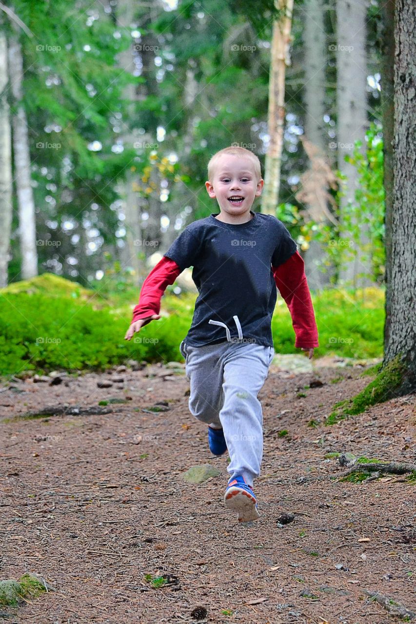 Happy boy running