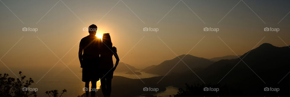 Couple staring at the sunset