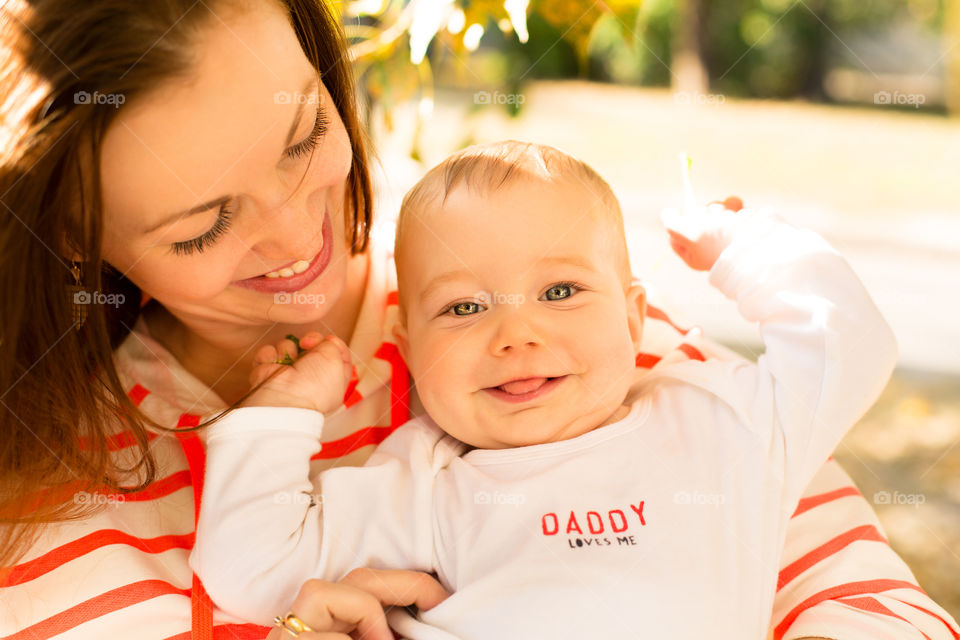 Smiling mother and baby boy