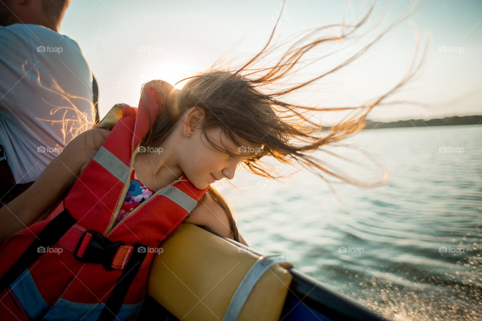 Funny girl portrait in a boat