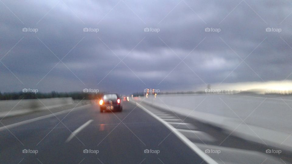 the car breaks through dark clouds