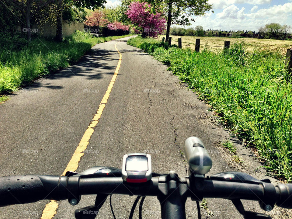 Close-up of bicycle on straight road