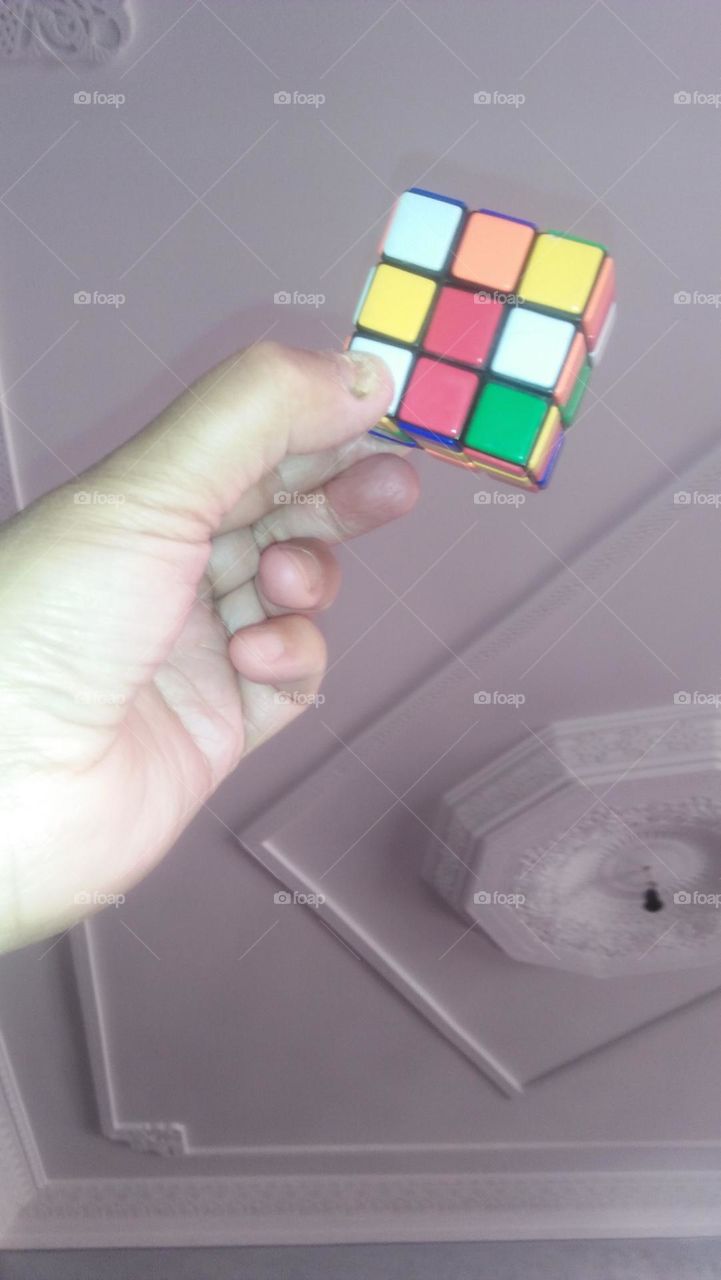 Hand holding cube game.