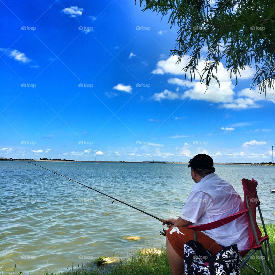 Waiting for the big fish. My boyfriend enjoying the weekend at the lake fishing. 