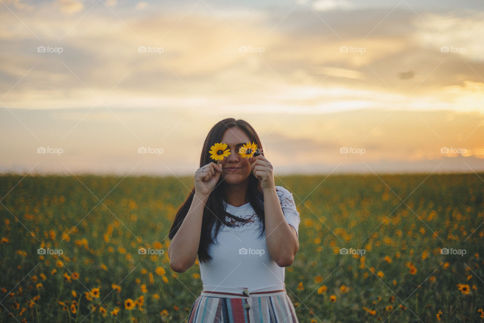 Girl in a sunflower field 