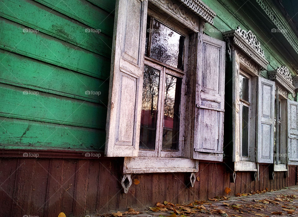 an old white window on the green background