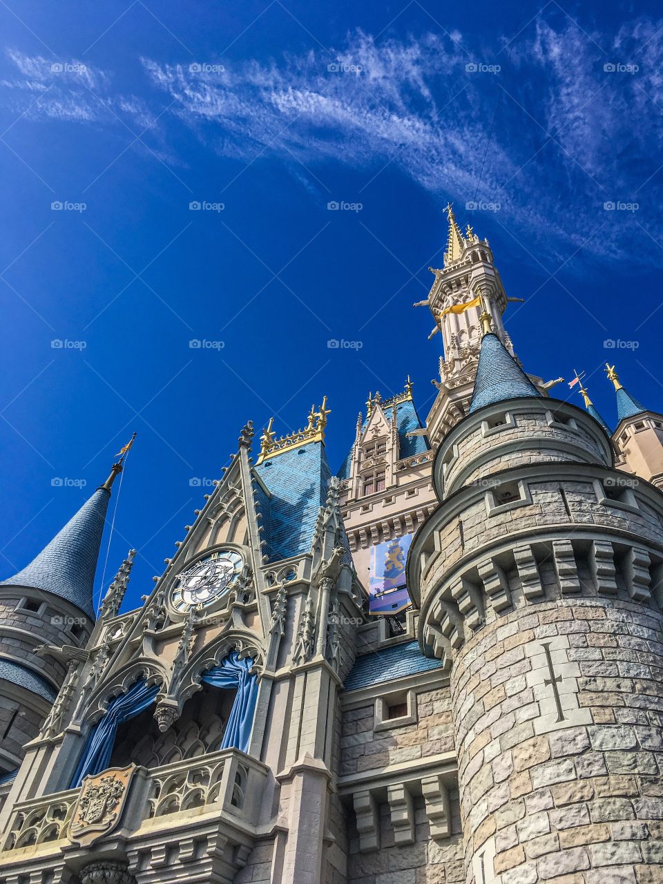Wispy white clouds floating over Cinderella Castle at the Magic Kingdom in Disney World, Orlando, Florida 