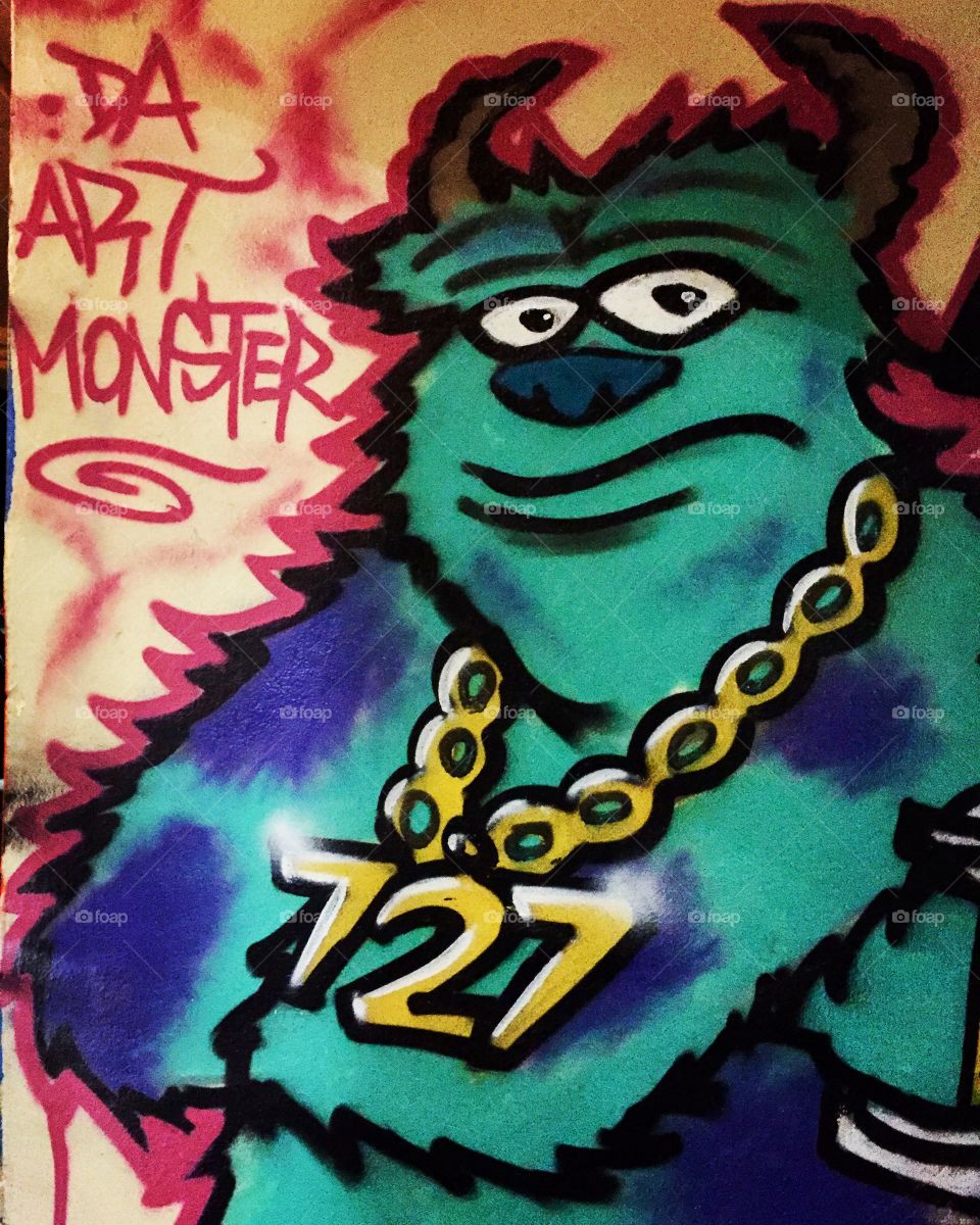 Found "DA art Monster" painting in a wall of a hallway full of graffiti 