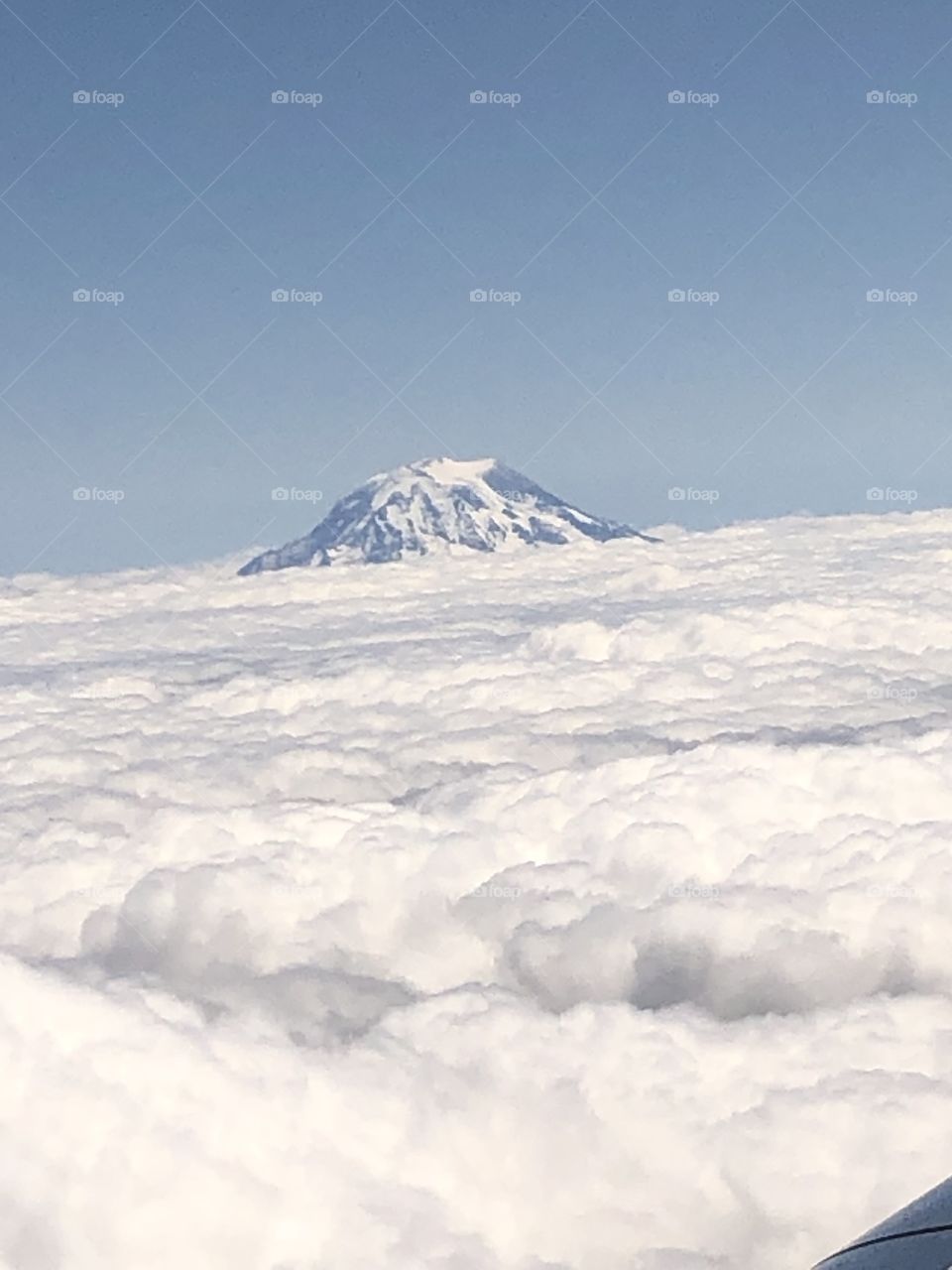 Mountain peeking over the clouds 