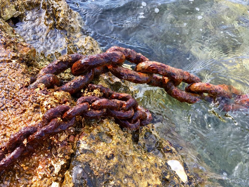 detail of old rusty chains of mooring