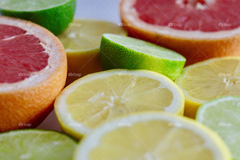 Fruits! - Grapefruit, lime and lemon halves on white background