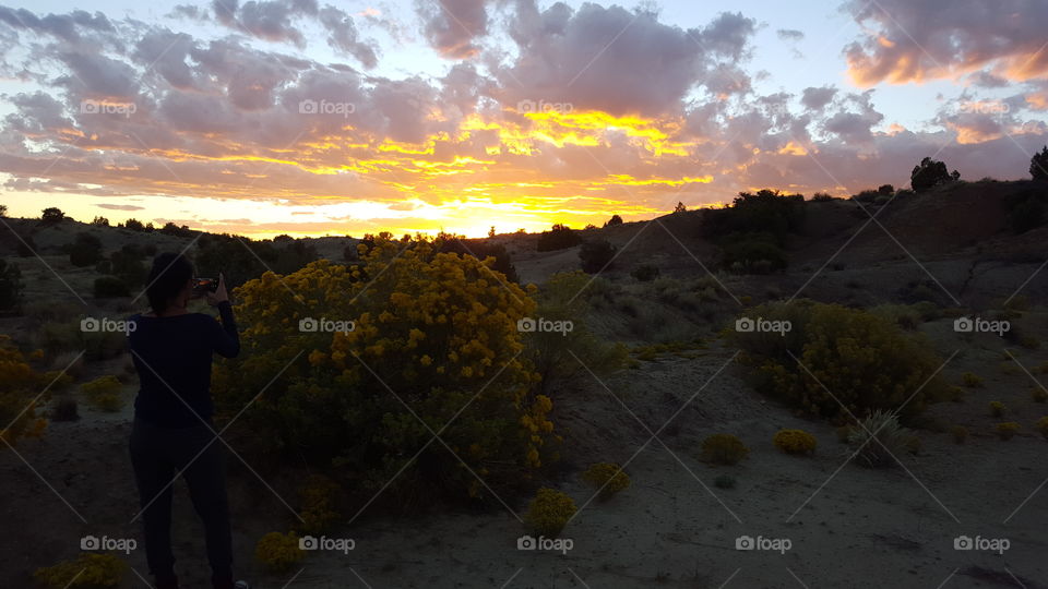 Momma capturing a beautiful sunset