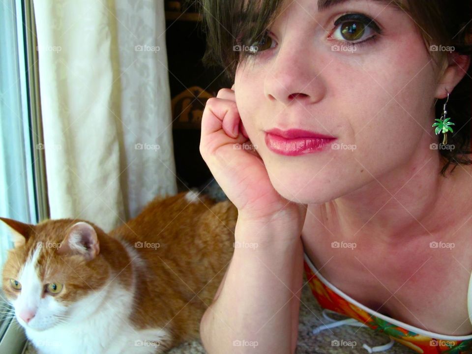 Gus and Me. Gus (my kitty) and I were watching the squirrels eating sunflower seeds outside the window.