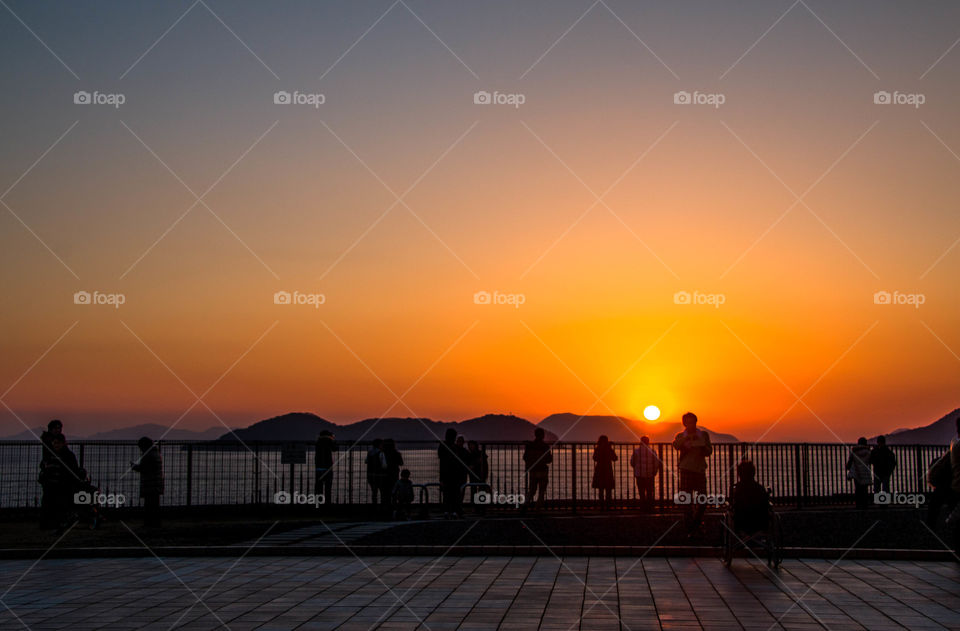 people are enjoying a beautiful sunset