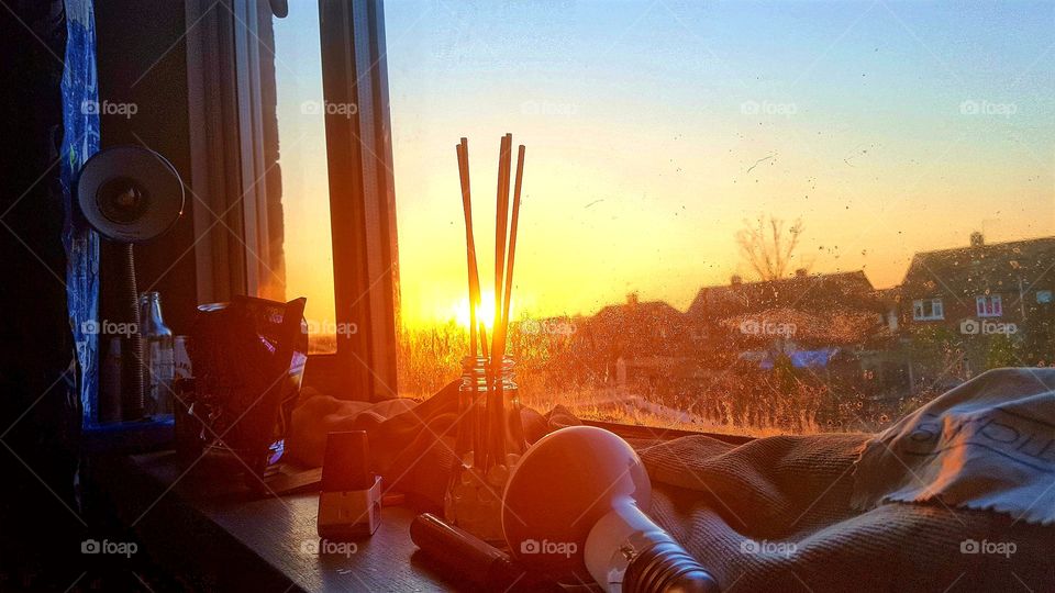 sunset with the mess of my widow sill