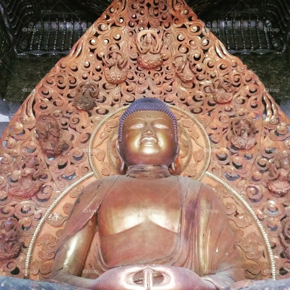 Front shot of Buddha statue at Byodoin Temple, O'ahu, Hawaii. Filtered shot.