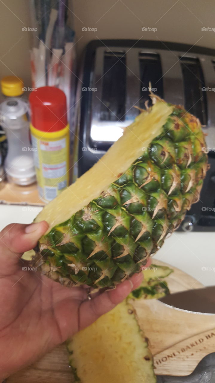 Cutting fresh Pineapple