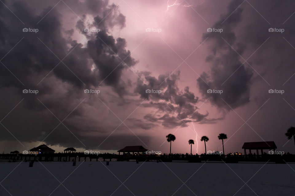 Colorful purple sky and lightning in a stormy evening 