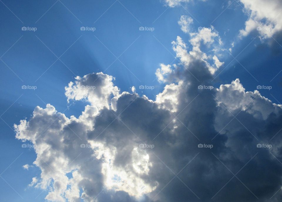 light beams through clouds