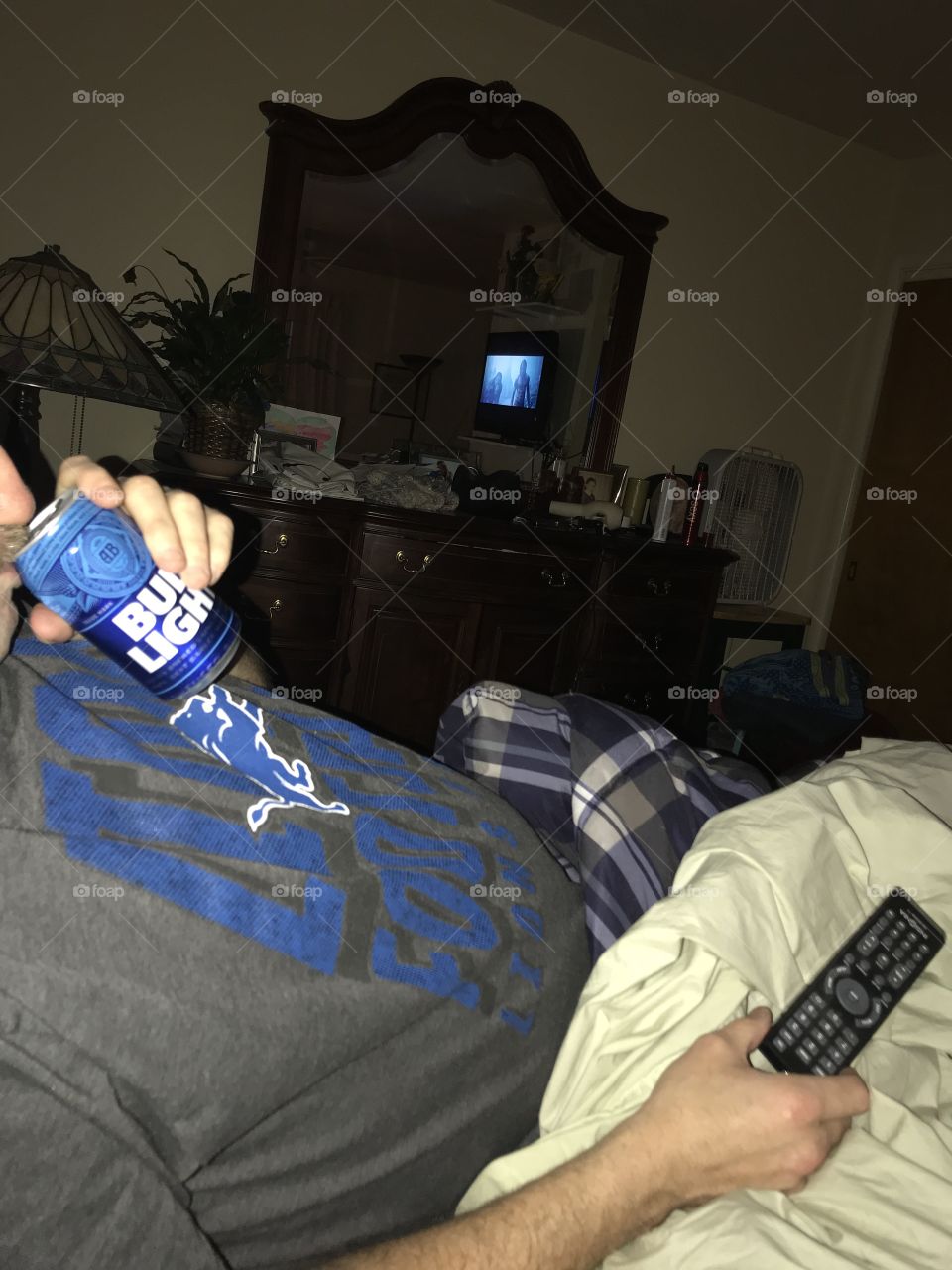 Enjoying Bud Light while watching a movie