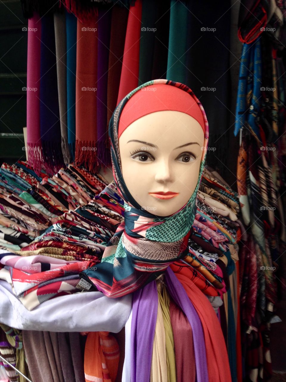 a dummy in a stall in the Tetuan market displaying head scarves