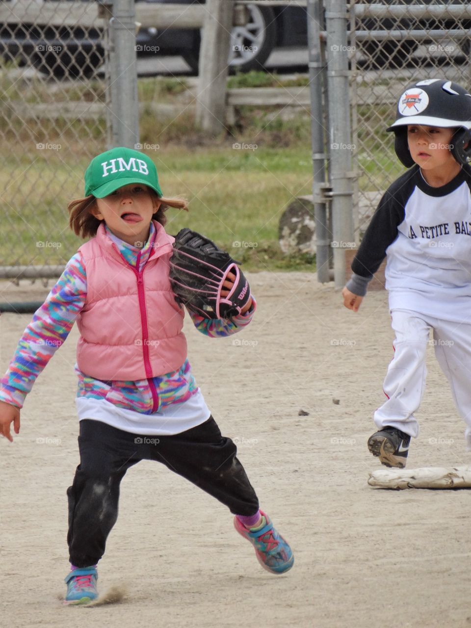 Boy And Girl Playing Baseball. American Children Playing Little League Baseball
