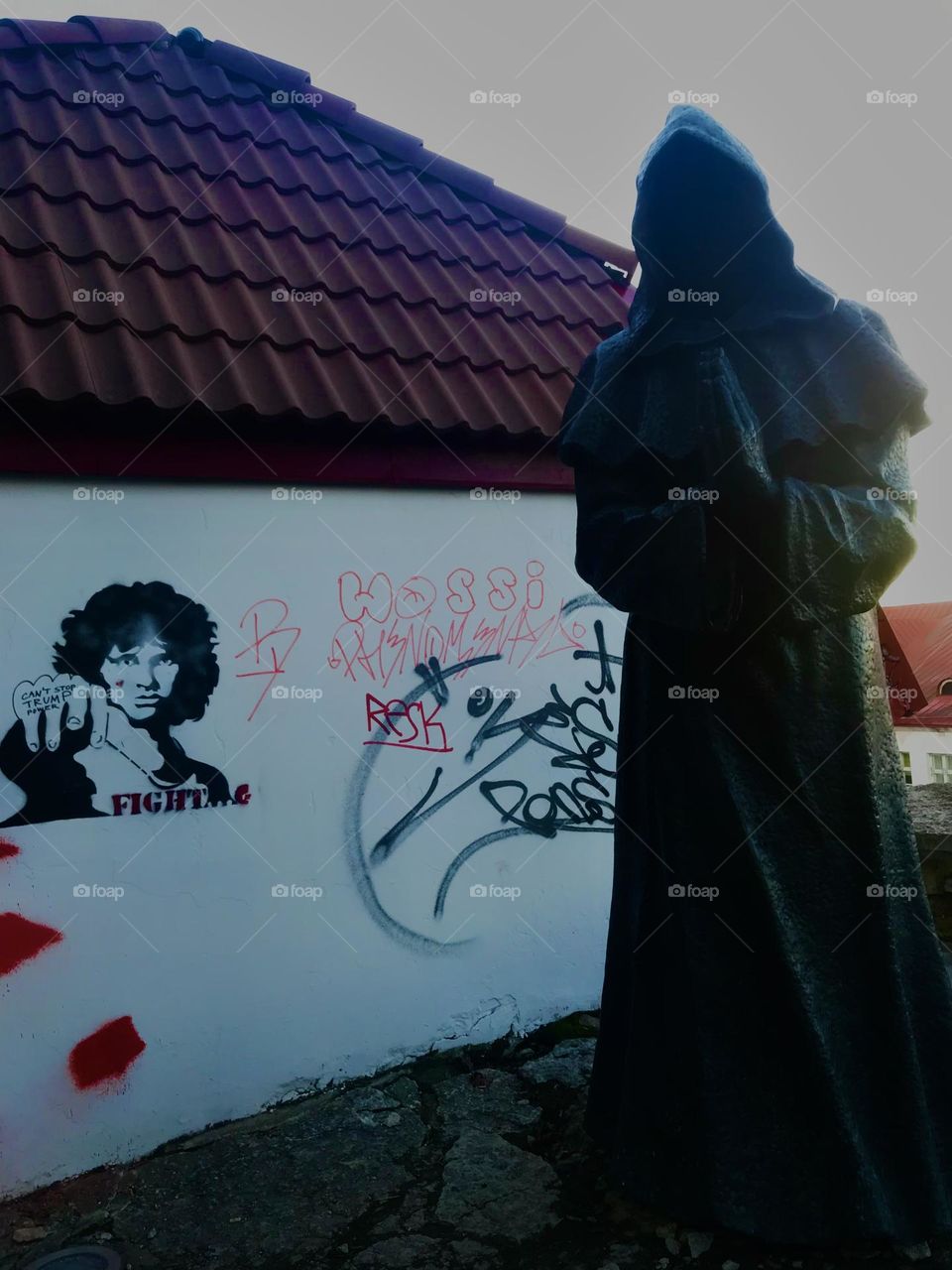 Faceless monk watching over Jim Morrison @Tallin, Estonia