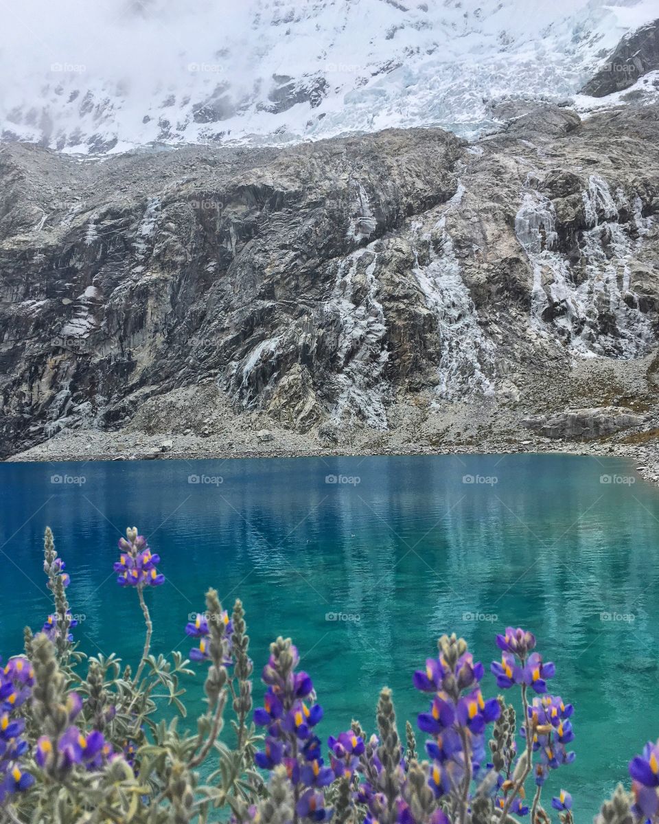 The incredible blue Lake 69 in Ancash Peru at 4500m altitude. We ate our lunch while the snow cooled off our faces. An amazing hike.