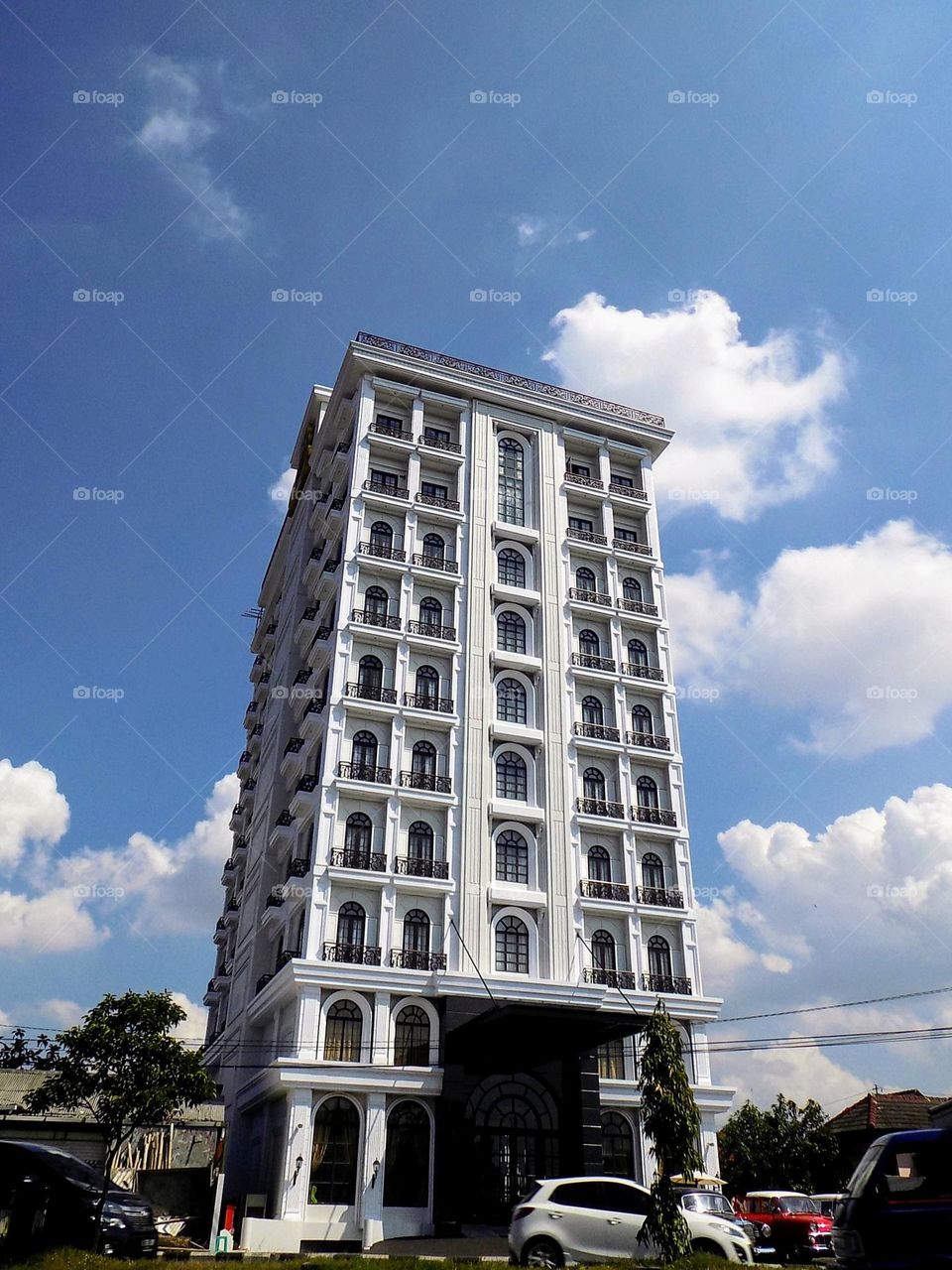Towering buildings behind the afternoon sky as if the color of marvel