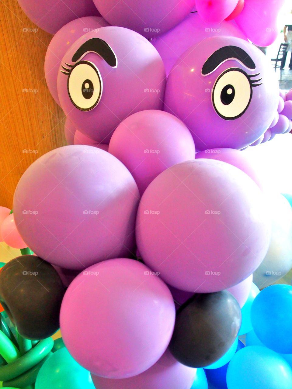 Purple balloons make shape as gartoon