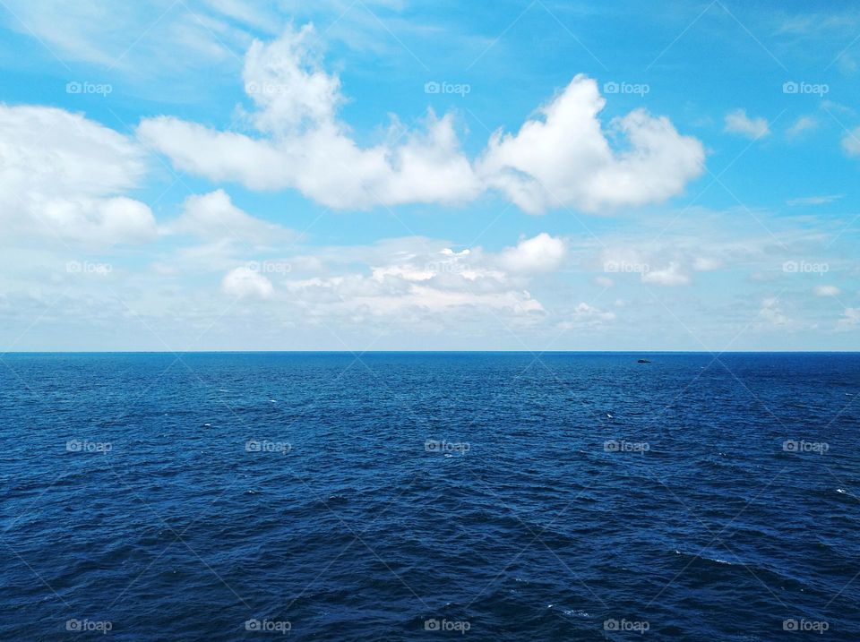 Cloud scape on the sea, beautiful formation of cumulus clouds.