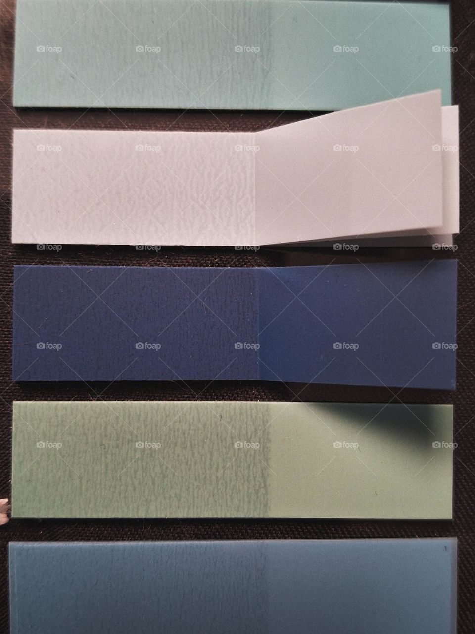 macro photo of small bookmarks for books or notebooks in various shades of blue in pastel colors