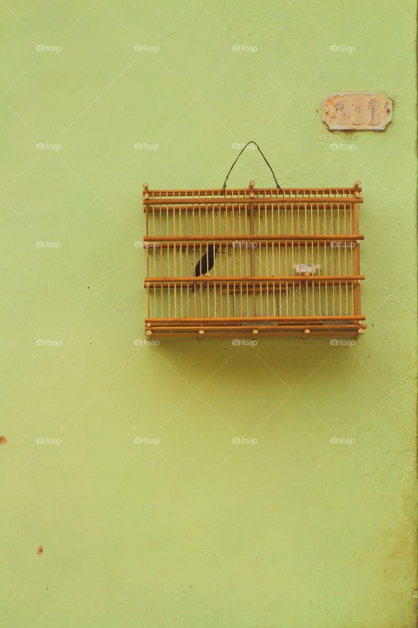 Caged . A cage in a wall on the streets of Havana, Cuba