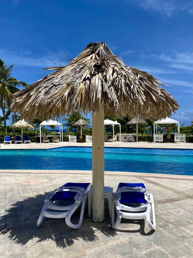 Poolside chaise lounges at the Bahia Principe Grand Jamaica hotel 