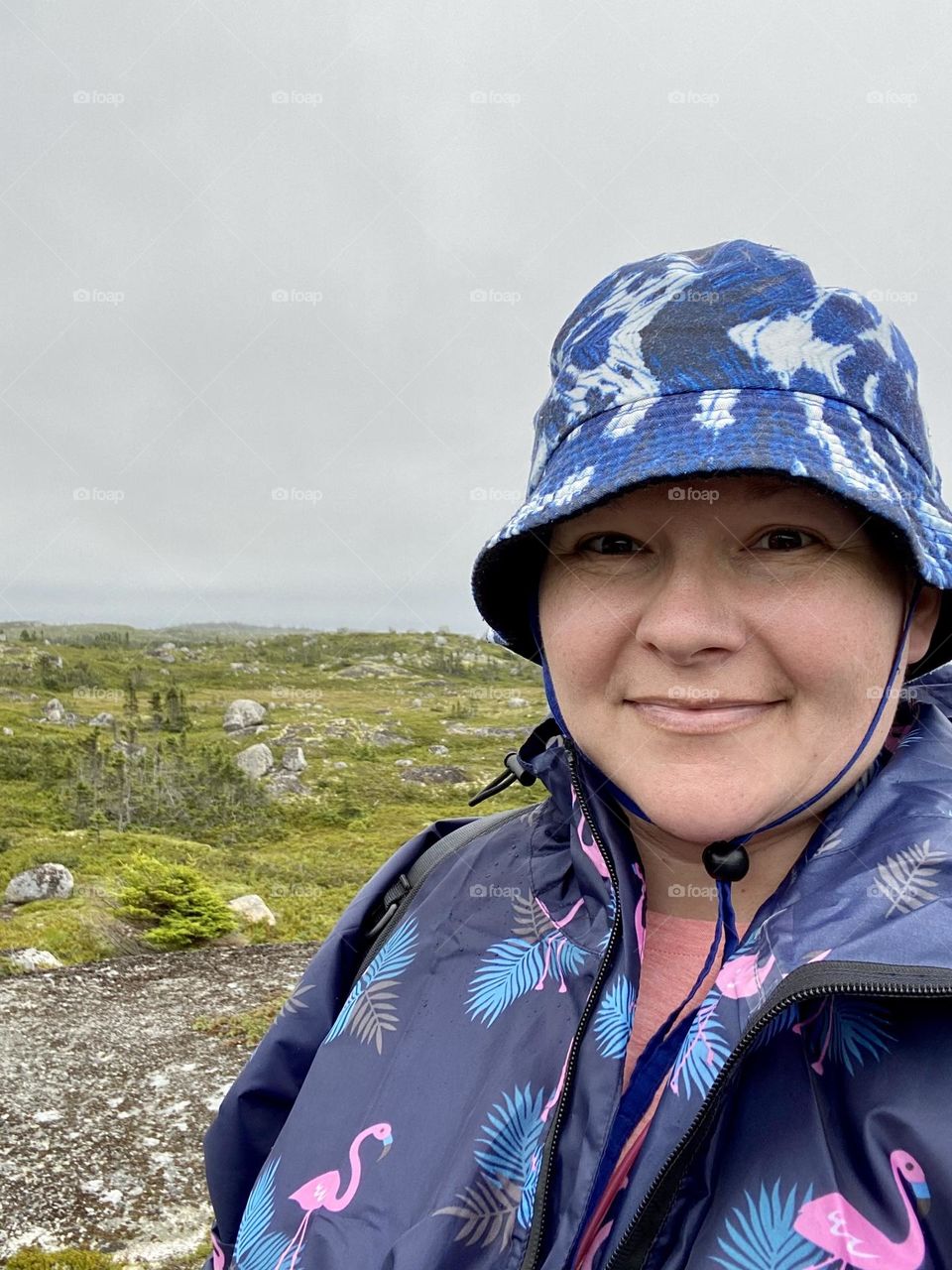A person outside on a cool foggy wet day