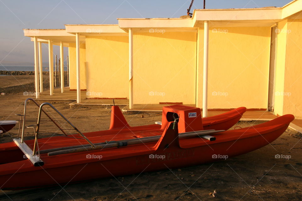 Red boat at beach