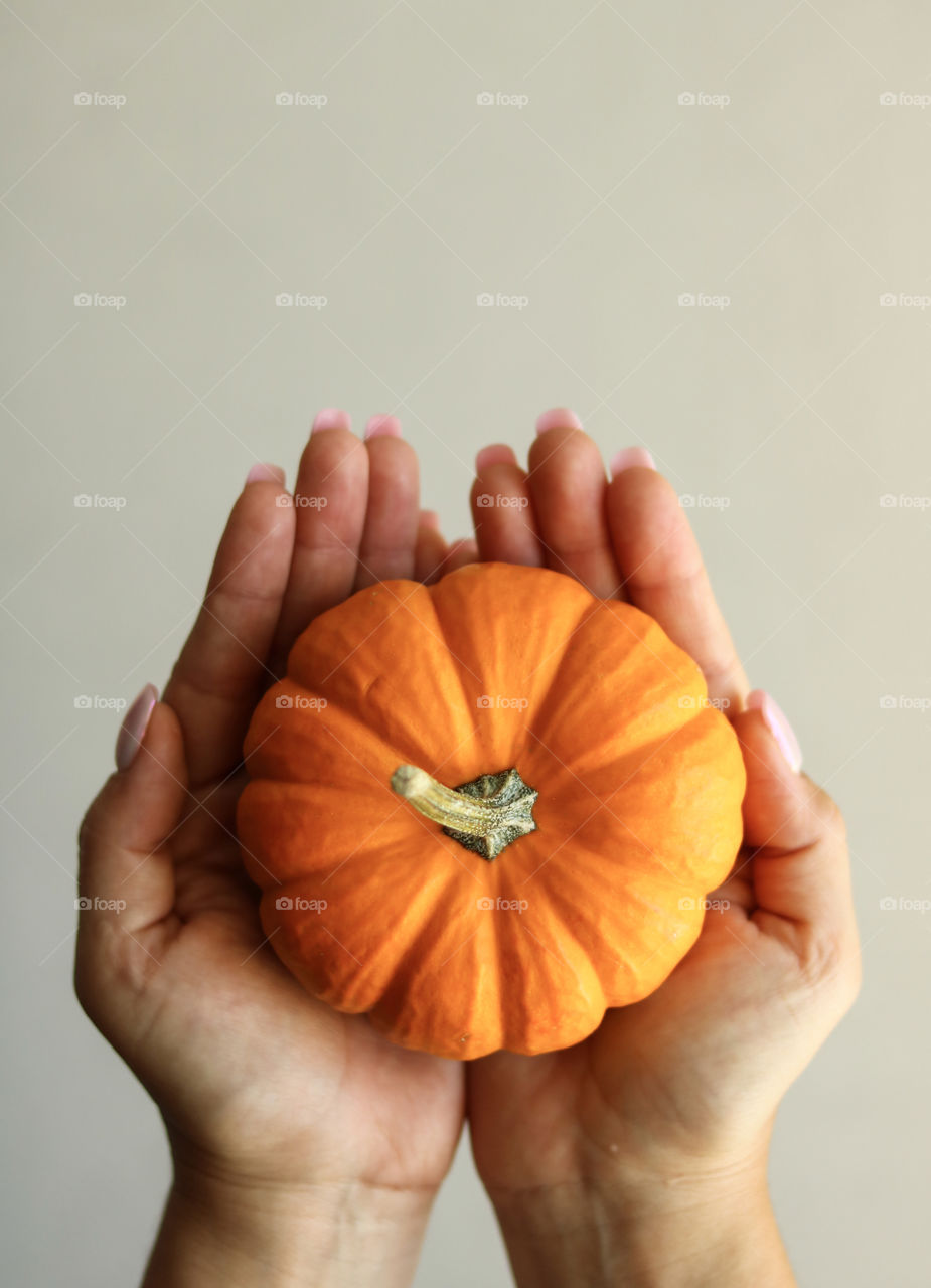 Holding a Pumpkin