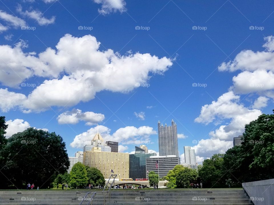 The skyline of Pittsburgh, Pennsylvania as seen from Point State Park on a sunny, blue-skies summer day