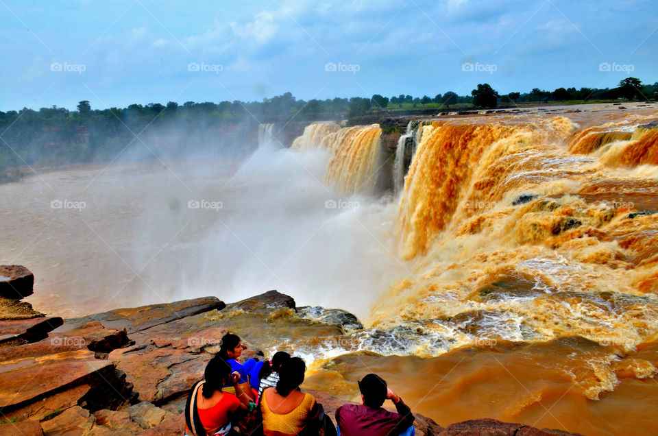 people enjoying waterfall