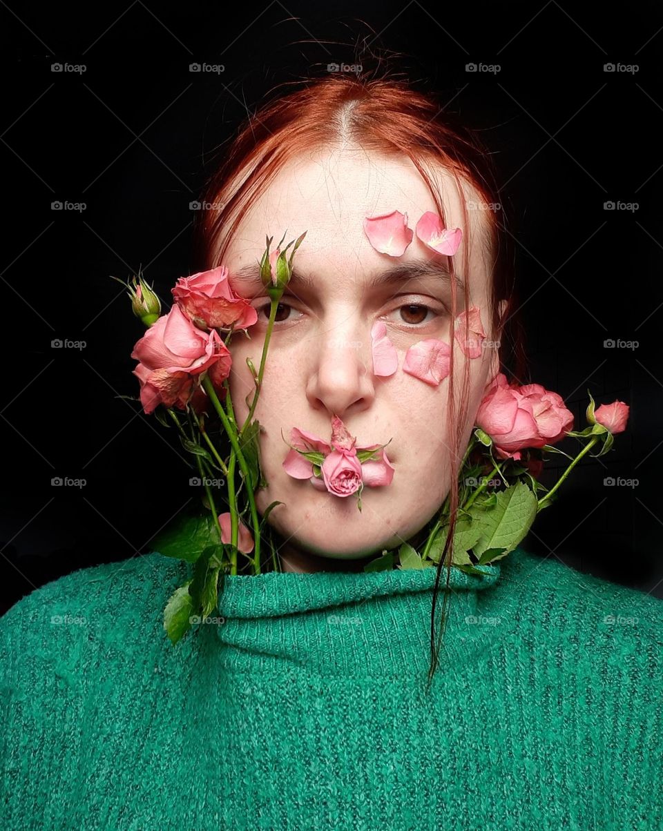 Girl's face with pink roses