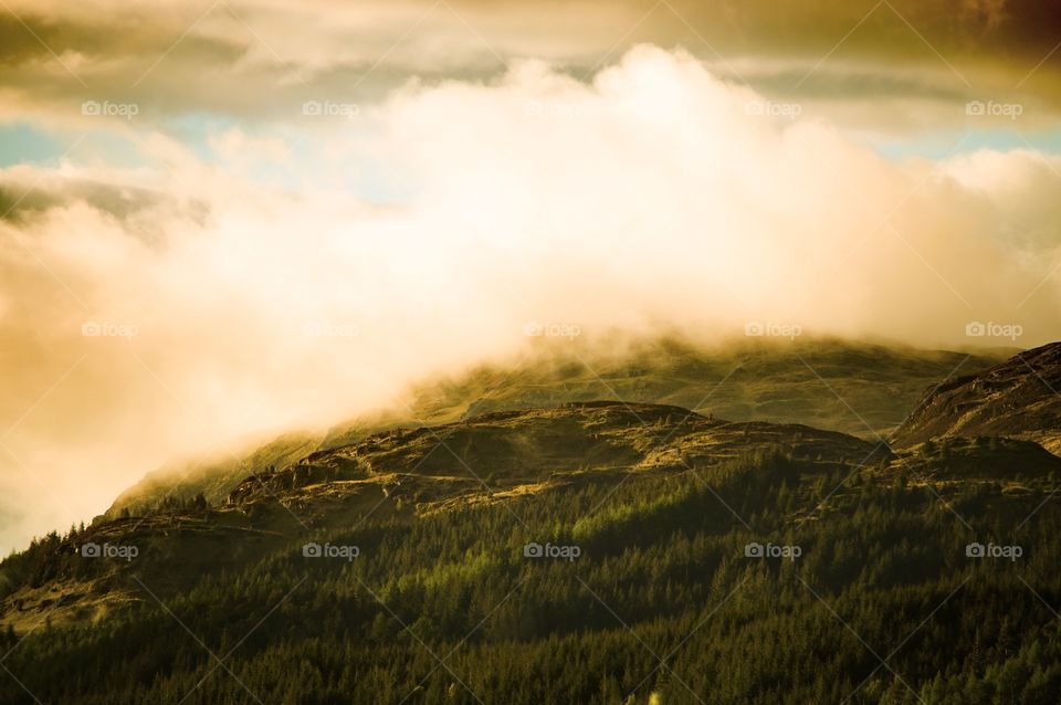 Scenic view of clouds over mountains